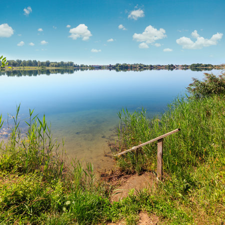 Picturesque summer lake landscape. Concept of tranquil country life, eco friendly tourism, camping, fishing.の写真素材