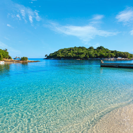 Beautiful Ionian Sea with clear turquoise water and morning summer coast view from beach (Ksamil, Albania).の写真素材