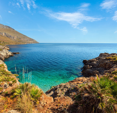 Paradise sea bay with azure water and beach  view from coastline trail of Zingaro Nature Reserve Park, between San Vito lo Capo and Scopello, Trapani province, Sicily, Italy. Two shots stitch image.の写真素材
