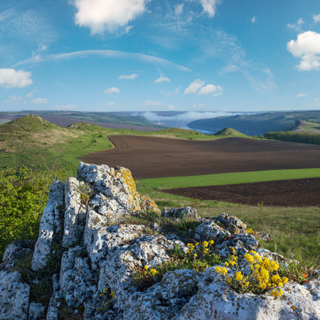 Amazing spring view on the Dnister River Canyon with picturesque rocks, fields, flowers. This place named Shyshkovi Gorby,  Nahoriany, Chernivtsi region, Ukraine.の写真素材