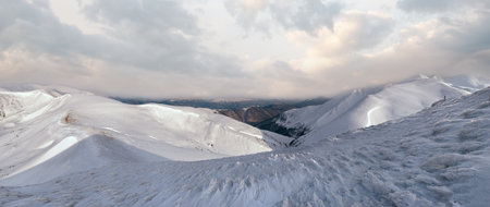 Mountain panorama in morning pastel illumination (Yasenja villadge, Zacarpatsjka Region, Ukraine).の写真素材