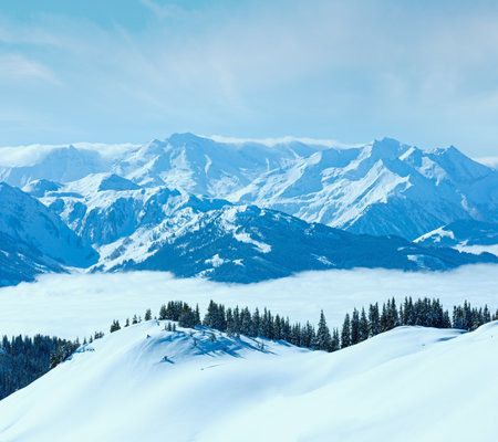 Morning winter mountain landscape with clouds in below valley (Hochkoenig region, Austria)の写真素材