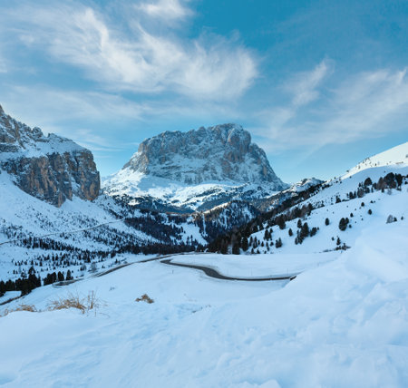 Morning winter rocky mountain landscape with serpentine road . Gardena Pass  in Dolomites of South Tyrol in northeast Italy.の写真素材