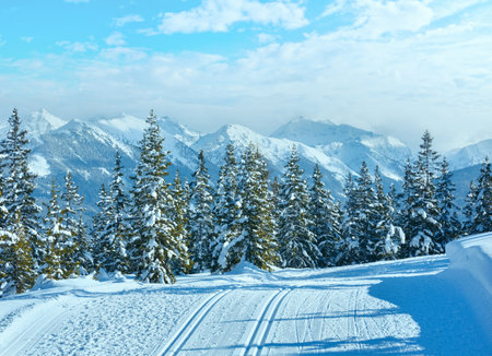 Winter mountain snowy landscape and ski slope (top of Papageno bahn - Filzmoos, Austria)の写真素材