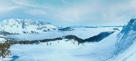 Morning winter mountain panorama with shadow of photographer (Hochkoenig region, Austria). All people are not identifiable.の写真素材