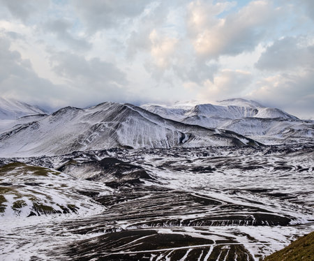 Season changing in southern Highlands of Iceland. Colorful Landmannalaugar mountains under snow cover in autumn.の写真素材