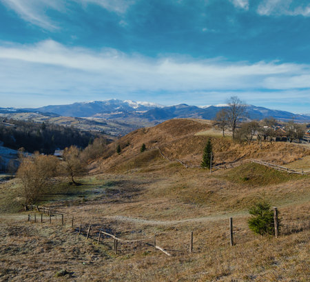 Last good weather days in autumn mountain countryside morning peaceful picturesque scene. Ukrainian Carpathians mountains in far.の写真素材