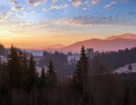 Picturesque sunrise above late autumn mountain countryside.  Ukraine, Carpathian Mountains. Peaceful traveling, seasonal, nature and countryside beauty concept scene.の写真素材