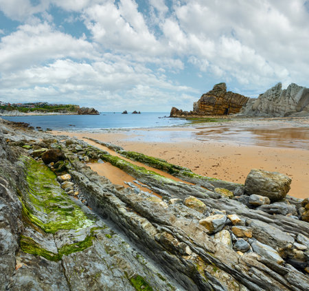 Detail of bare rocks because of low tide at cbeach (Pielagos, Cantabria)の写真素材