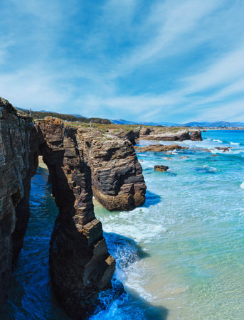 Natural rock arches on Cathedrals beach in low tide (Cantabric coast, Lugo, Spain).の写真素材