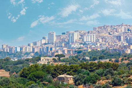View to Agrigento town from famous ancient ruins in Valley of Temples, Sicily, Italy.の写真素材