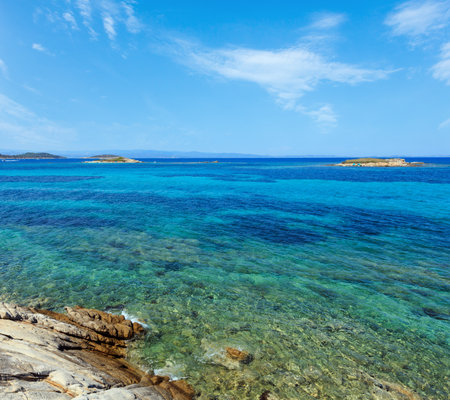 Aegean sea coast landscape with rocky island, view near Karidi beach (Chalkidiki, Greece).の写真素材