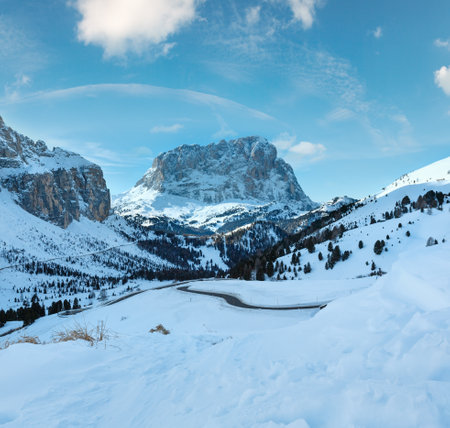 Morning winter rocky mountain landscape with serpentine road . Gardena Pass  in Dolomites of South Tyrol in northeast Italy.の写真素材