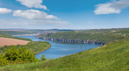 Amazing spring view on the Dnister River Canyon with picturesque rocks, fields, flowers. This place named Shyshkovi Gorby,  Nahoriany, Chernivtsi region, Ukraine.の写真素材