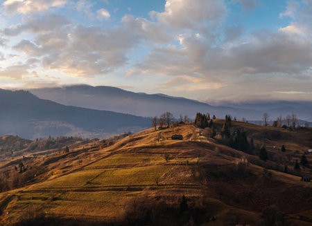 Last good weather days in autumn mountain countryside. Peaceful picturesque Ukrainian Carpathians mountains scene.の写真素材