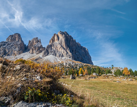 Autumn alpine Dolomites mountain scene, Sudtirol, Italy. Peaceful view near Sella Pass. Picturesque traveling, seasonal, nature and countryside beauty concept scene.の写真素材