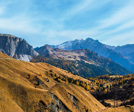 Autumn alpine Dolomites mountain scene, Sudtirol, Italy. Peaceful view near Sella Pass. Picturesque traveling, seasonal, nature and countryside beauty concept scene.の写真素材