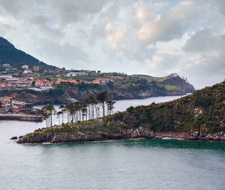 Summer Lekeitio town coasline and San Nicolas island (isla de San Nicolas), Biscay, Spain,  Basque Country.の写真素材