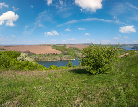 Amazing spring view on the Dnister River Canyon with picturesque rocks, fields, flowers. This place named Shyshkovi Gorby,  Nahoriany, Chernivtsi region, Ukraine.の写真素材