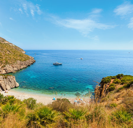Paradise sea bay with azure water and beach  view from coastline trail of Zingaro Nature Reserve Park, between San Vito lo Capo and Scopello, Trapani province, Sicily, Italy. People unrecognizable.の写真素材