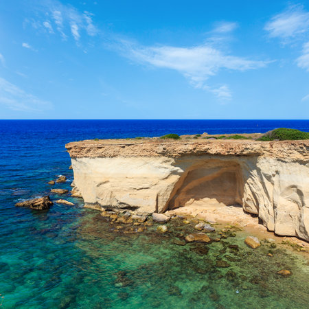 Grottoes on Spiaggia Massolivieri beach. Summer sea landscape (Siracusa, Sicily, Italy)の写真素材