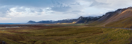 View during auto trip in Iceland. Spectacular Icelandic landscape with  scenic nature: mountains, ocean coast, fjords, fields, clouds, glaciers, waterfalls..の写真素材