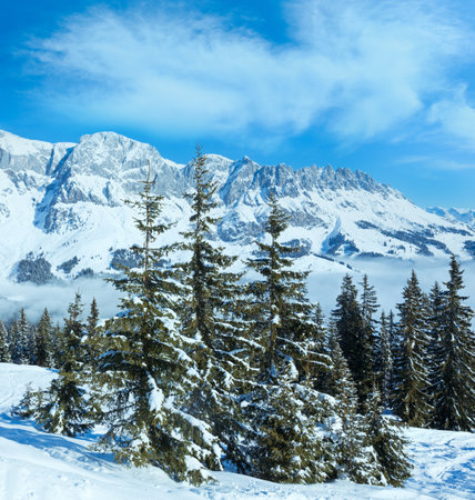 Morning winter mountain landscape with clouds in below valley (Hochkoenig region, Austria)の写真素材