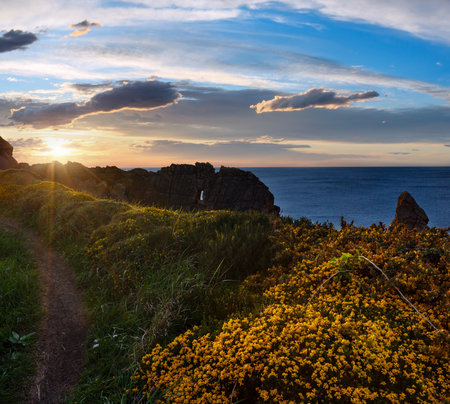 Sunset on blossoming Arnia Beach (Spain, Atlantic Ocean).の写真素材