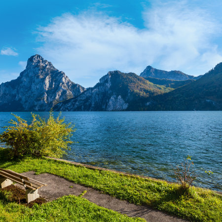 Peaceful autumn Alps mountain lake. Morning view to Traunsee lake and Traunstein mountain in far, Upper Austria.の写真素材