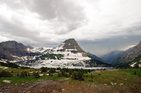 Storm clouds over Bearhat mountain in Glacier National Parkの写真素材