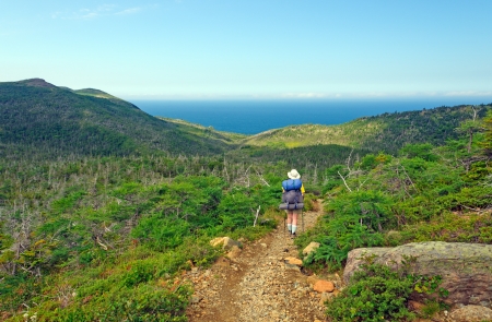Backpacker hiking the Green Gardens trail in Gros Morne National parkの写真素材