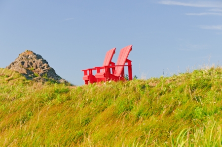 Red Chairs on a Beach Overlook in Gros Morne National Parkの写真素材