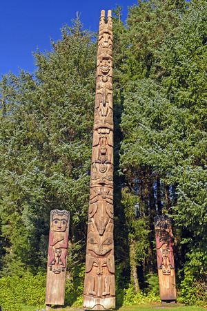 Totem Poles at a Coastal Preserve in Sitka National Historic Park in Alaskaの写真素材