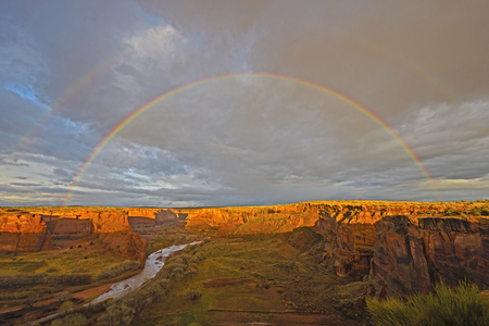 Double Rainbow at Sunset over Canyon de Chelly in Arizonaの写真素材