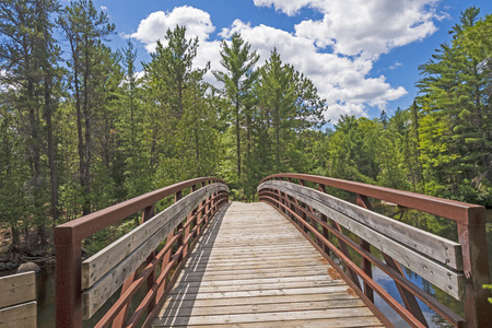 Bridge into the North Woods in Chutes Provincial Park in Ontario, Canadaの写真素材