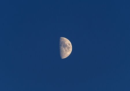 Half Moon in an Evening Sky over the Boundary Waters in Minnesotaの写真素材