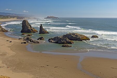 Rolling Waves on a Rocky Ocean Beach near Bandon, Oregonの写真素材
