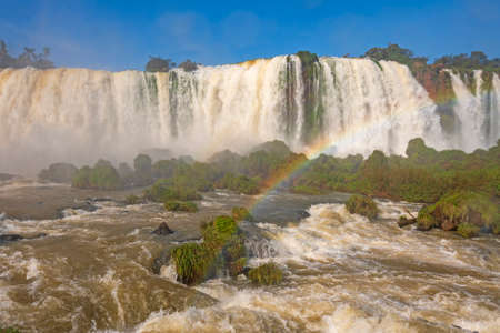 Raging Waters and Verdant Growth Below the Falls at Iguazu Falls in Brazilの写真素材