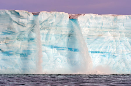 Twin Waterfall on a Melting Tidal Glacier on Nordaustlandet Island in the Svalbard Islands