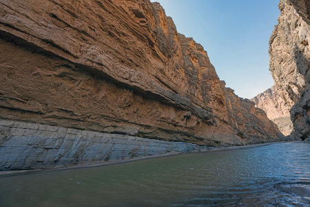 Desert River Cutting Through the Layers of Rock in Santa Elena Canyon in Big Bend National Park in Texasの写真素材