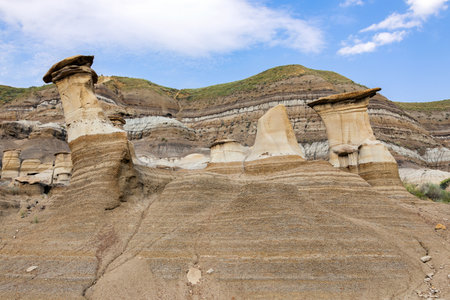 Famous Hoodoos, sandstone columns with a capstone on top standing in badlands. Hoodoos trail, Drumheller, Alberta, Canada.の写真素材