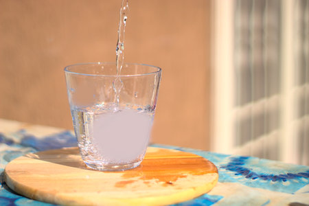 flow of water poured into a glassの写真素材