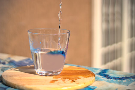 flow of water poured into a glassの写真素材