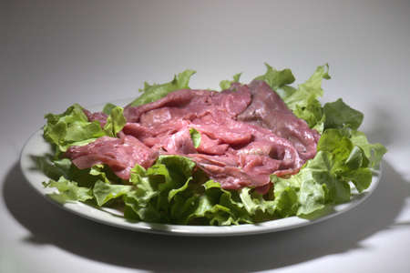 raw beef called 'Carne Salada' served with lettuce leavesの写真素材