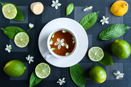 White cup with tea. Green, black, herbal, jasmine tea with lemon and ginger.Background. Tea theme  View from above
の写真素材