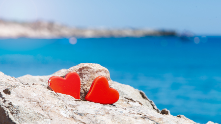 Concept of two hearts against the blue sea. I love the seaの写真素材