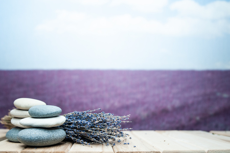 Ðockup,  background lavender field and massage stones and lavender , space for textの写真素材