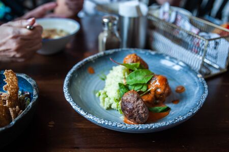 Meatballs with sauce and mashed potatoes, rustic styleの写真素材