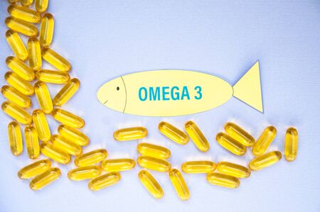 Fish oil omega 3 soft gel capsule pills, healthy product   and   supplement  concept close up,  flat layの写真素材