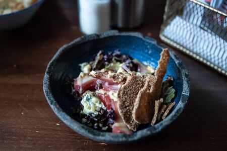 Salad with wine pear, crackers and blue cheeseの写真素材